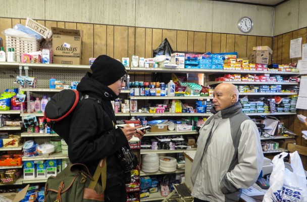 Brian Adams interviews Karl Ashenfelter at the White Mountain Native Store. (Photo by Laura Kraegel/KNOM)