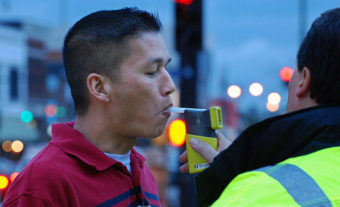 Tim Uong takes a Breathalyzer test at “Know Your Limit” in Columbia, Mo., on Friday, April 26, 2013. He says the event helped him learn how much one beer would affect his blood alcohol content level. (Creative Commons photo by KomU News)