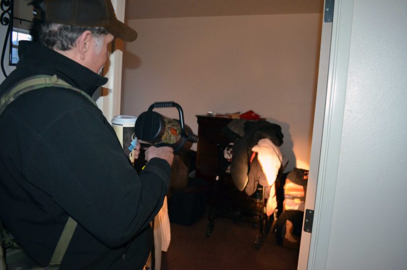 Dennis Wharton lives in the apartment below the one that caught fire. He said his clothes and furniture are soaked, but that some of his keepsakes are safe. (Photo by Jennifer Canfield/KTOO)