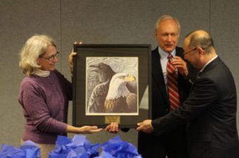 Mayor Mim McConnell and City Administrator Mark Gorman welcomed Nemuro city council member Toshiharu Honda on Monday (04-01-16) with a Tlingit print. (Photo by Emily Kwong/KCAW)