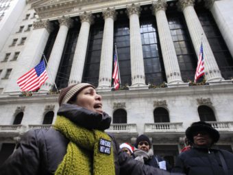 Demonstrators voiced opposition to year-end bonuses for Wall Street executives, during a protest outside the New York Stock Exchange in December 2010. Mark Lennihan/AP