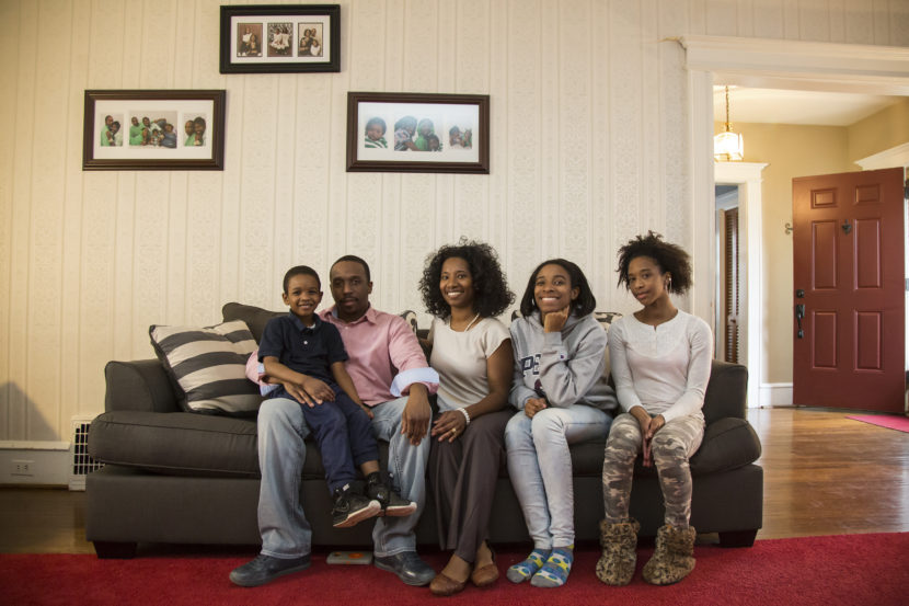 The Miller family sits in the living room of their home in a Philadelphia suburb. They are part of an ongoing lawsuit, arguing Pennsylvania has neglected its constitutional responsibility to provide all children a "thorough and efficient" education. Emily Cohen for NPR
