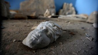 The face of a statue lies on the ground at the destroyed museum in the ancient Syrian city of Palmyra on March 31. Joseph Eid/AFP/Getty Images