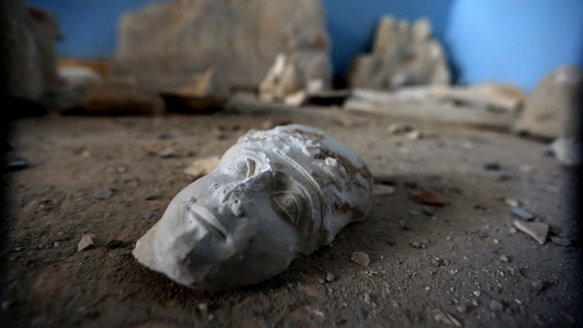 The face of a statue lies on the ground at the destroyed museum in the ancient Syrian city of Palmyra on March 31. Joseph Eid/AFP/Getty Images