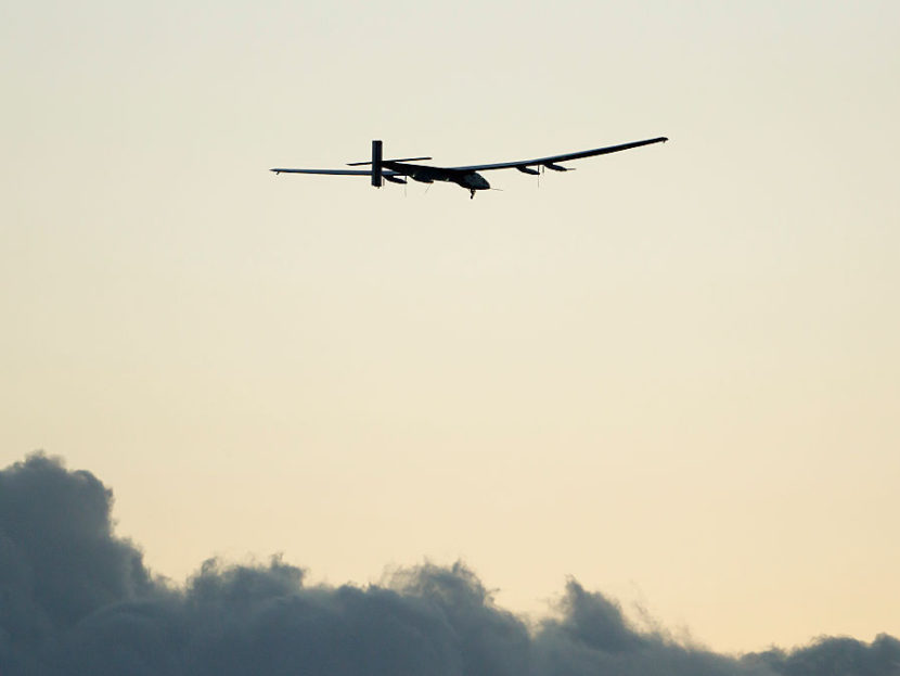 The Solar Impulse 2 airplane, piloted by Bertrand Piccard, gains altitude after taking off from Kalaeloa Airport in Kapolei, Hawaii during a test and training flight in April. Eugene Tanner /AFP/Getty Images