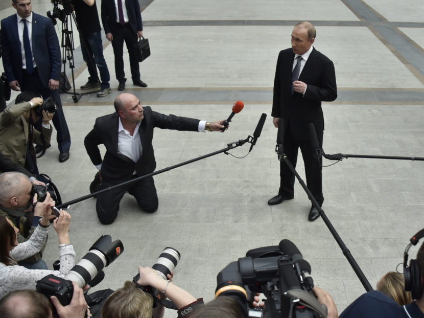 Russian President Vladimir Putin speaks with members of the press after his annual call-in show in Moscow on April 14. Alexander Nemenov/AFP/Getty Images