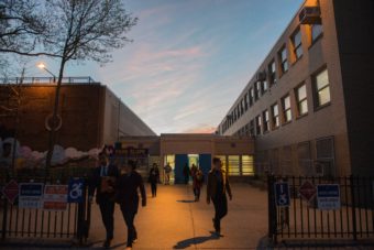 People exit the building after voting at P.S. 282 in Brooklyn on Tuesday. Stephanie Keith /Getty Images
