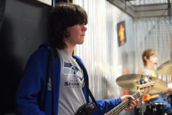 William Smoker, 14, plays the bass at Alaska Music One. (Photo by Annie Bartholomew/KTOO)