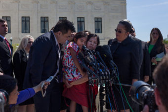 Immigrant activists, including Jose Antonio Vargas and Sophie Cruz, speak to reporters after oral arguments at the Supreme Court. Kara Frame/NPR