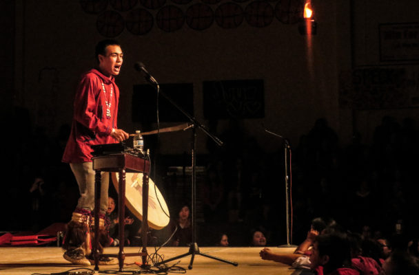 Byron Nicholai sings and drums at the 2016 Cama-i Dance Festival in Bethel. (Photo by Laura Kraegel/KNOM)