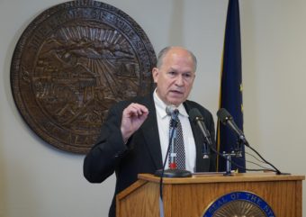 Alaska Gov. Bill Walker answers questions from the press in his temporary office in the community building in Juneau, May 19, 2016. (Photo by Jeremy Hsieh/KTOO)