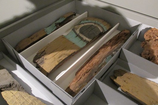 Fragments from the Chief Skowal pole. (Photo by Maria Dudzak/KRBD)