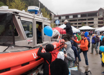 A U.S. Coast Guard boat was open for visitors to climb aboard at the 2016 Juneau Maritime Festival (Photo by David Purdy/KTOO)
