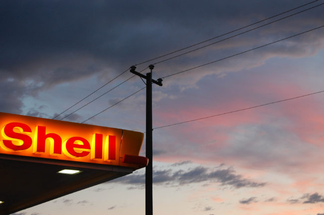Shell sign gas station logo at sunset