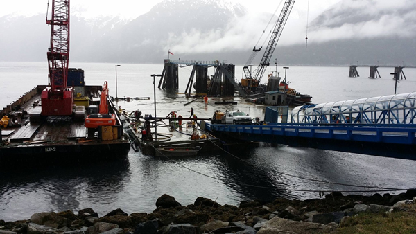 Western Marine Construction works to refloat the Skagway ferry dock in 2014 after it sunk. (Photo courtesy of the Alaska Department of Transportation and Public Facilities)