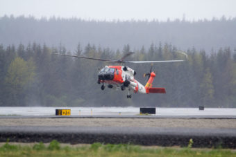 A US Coast Guard helicopter lands at Juneau International Airport on Thursday May 5th, 2016. (Photo by Mikko Wilson / KTOO)