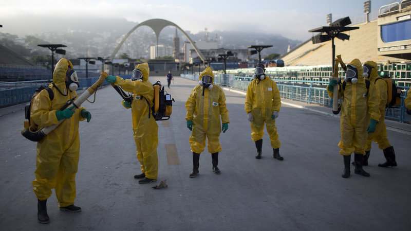 Health workers get ready to spray insecticide to combat the Aedes aegypti mosquitoes that transmits the Zika virus in January, under the bleachers of the Sambadrome in Rio de Janeiro, which will be used for the Archery competition in the 2016 summer games.