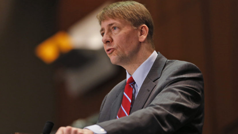 Consumer Financial Protection Bureau Director Richard Cordray says financial firms use arbitration to "sidestep the legal system [and] avoid accountability." But industry officials say a proposed ban on mandatory arbitration clauses will lead to frivolous legal action. Steve Helber/AP