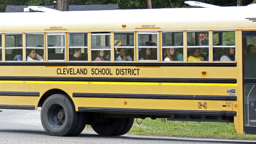 Public school students in Cleveland, Miss., ride the bus on their way home following classes in May 2015. Rogelio V. Solis/AP