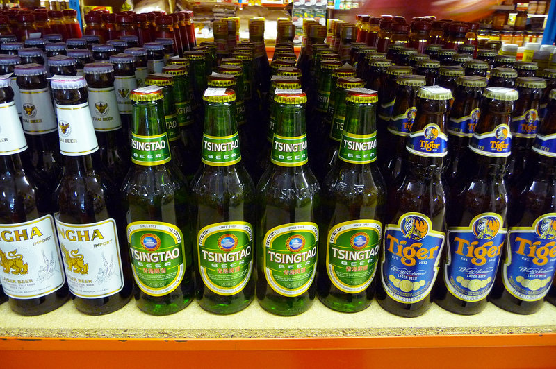 Chinese beer brands on display at a supermarket. An ancient brewery discovered in China's Central Plain shows the Chinese were making barley beer with fairly advanced techniques some 5,000 years ago. Chris/Flickr