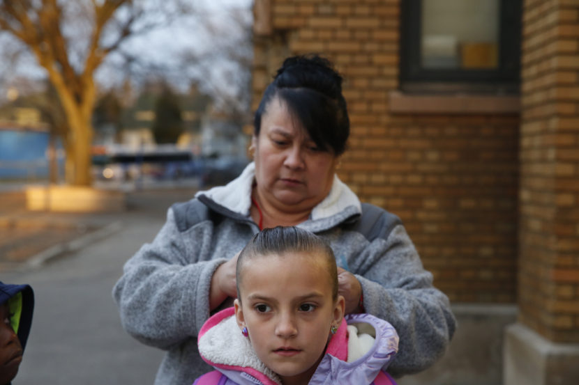 Cyndy Bulson fixes her granddaughter's hair before school starts at Stocking Elementary School. (Photo by Elissa Nadworny/NPR)