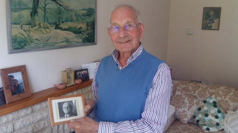 John Fieldsend, 84, with a photo he keeps on his fireplace mantel of Nicholas Winton, the man who saved his life. Fieldsend, born Hans Heini Feige, was one of 669 mostly Jewish children whom Winton rescued from Czechoslovakia just prior to World War II. For his efforts, Winton is called "Britain's Schindler." He died last year at 106. Lauren Frayer for NPR