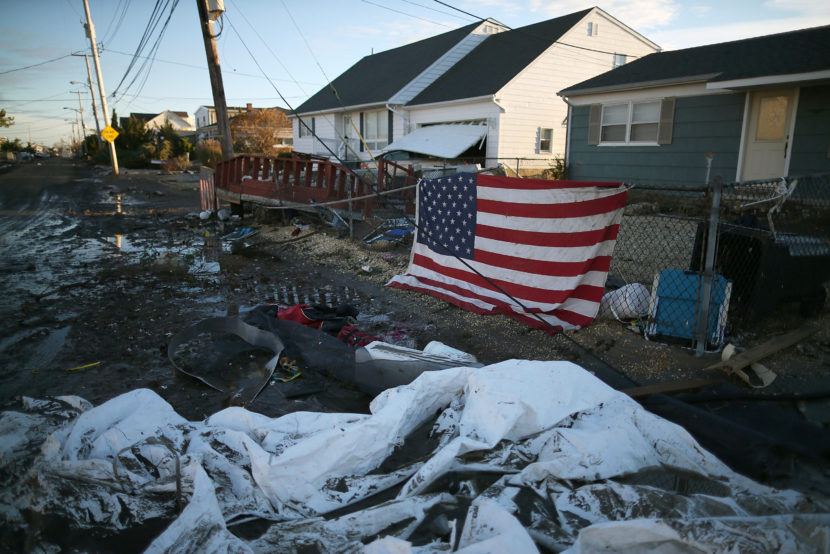 An American flag flies in front of a home damaged by Superstorm Sandy on Nov. 1, 2012, in Toms River, N.J. Mark Wilson/Getty Images