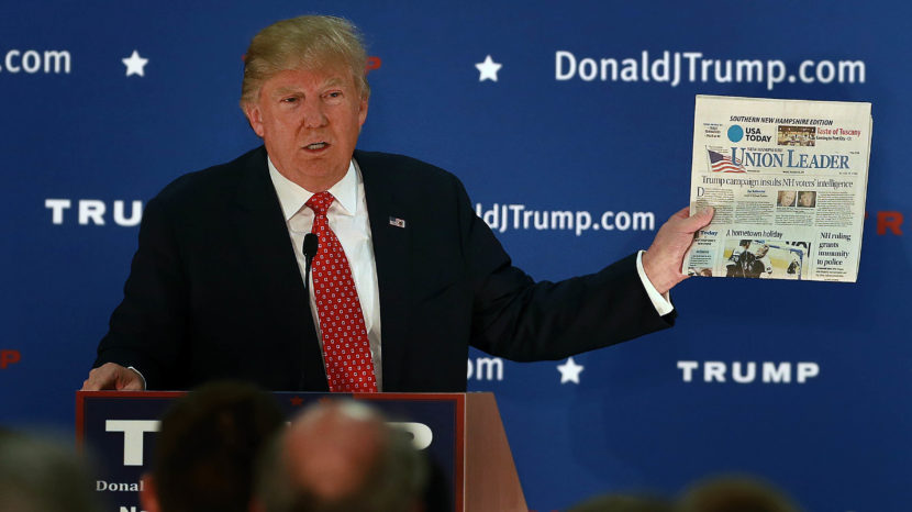 Republican presidential candidate Donald Trump frequently held up newspapers while on the campaign trail. Boston Globe/Boston Globe via Getty Images