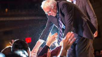 Democratic presidential candidate Bernie Sanders shakes hands with supporters in January in New York City. Andrew Burton/Getty Images