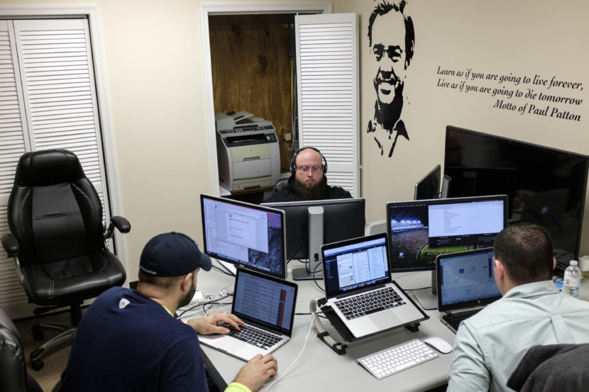 Software coders (from left) William Stevens, Michael Harrison and Brack Quillen work at the Bit Source office in Pikeville, Ky., in February. The year-old firm has trained laid-off coal workers to become software coders. Sam Owens/Bloomberg via Getty Images