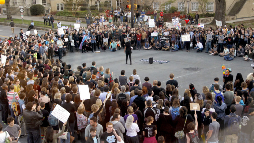 Hundreds attend a rally in Chapel Hill, N.C., on March 29 to protest the passage of House Bill 2. The state of North Carolina and the U.S. Justice Department are suing each other over the law's restriction on protections for lesbian, gay, bisexual and transgender people. Chris Seward/Raleigh News & Observer/TNS via Getty Images