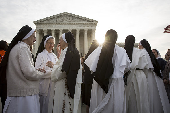 Nuns opposed to the Affordable Care Act's contraceptive mandate rally outside the Supreme Court on March 23 prior to oral arguments in Zubik v. Burwell. The Supreme Court sent the case back to a lower court on Monday. Drew Angerer/Bloomberg/Getty Images