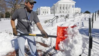 Joe Damico, deputy director of the Virginia Department of General Services, shovels a walkway to the State Capitol this winter. Faced with a wave of retirement, states are looking for ways to keep experienced employees until they can shore up their talent reserves. AP