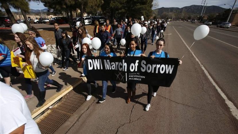 Middle school students in Santa Fe, N.M., march to honor DWI death victims. States like New Mexico, where alcohol-related deaths are above the national norm, have been mining data to raise awareness of preventable deaths. AP