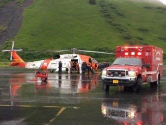 The U.S. Coast Guard and emergency medical personnel transfer patients from a MH-60 Jayhawk helicopter to an ambulance in Kodiak, Alaska, June 2, 2016. The helicopter crew responded to a report of a fire at the Park’s Cannery near Uyak Bay on Kodiak Island. (Public Domain photo by U.S. Coast Guard)
