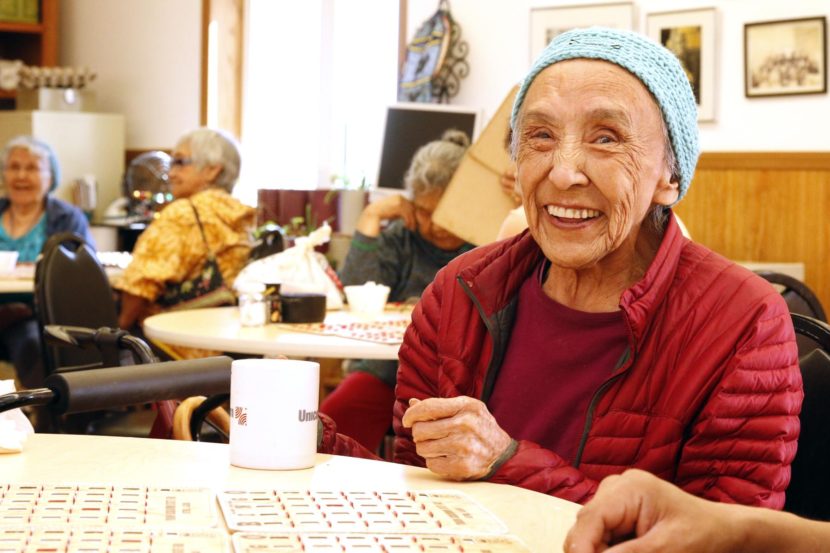 Catherine Peters, age 82, playing bingo at the ONC Senior Center. (Photo by Dean Swope/KYUK)