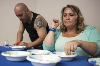 Paul Johnson and Ashley Colon were two of three judges for the black seaweed contest, hosted by the Sealaska Heritage Institute at Celebration 2016. (Photo by Rashah McChesney/KTOO)