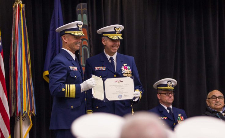 Vice Admiral Charles W. Ray presents Rear Admiral Daniel B. Abel with the Legion of Merit award at the change of command ceremony in Juneau on June 15, 2016 (Photo by David Purdy/KTOO)