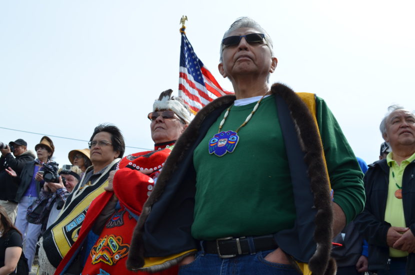 Before the canoes can come ashore, they must get permission from the Auke Kwan Tlingits of Juneau. Fran Houston of the Auke Kwan was joined by Paul Marks of the Douglas Indian Association to carry out the tradition. (Photo by Emily Kwong/KCAW)