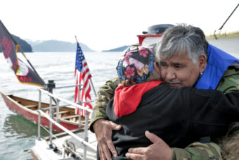 Members of the One People Canoe Society share a hug before hopping into canoes to finish paddling from Angoon to Juneau on Wednesday, June 8, 2016, near Juneau, Alaska. The society began the trip on June 2. Their landing on Douglas Island is the unofficial beginning of Celebration. (Photo by Rashah McChesney/KTOO)