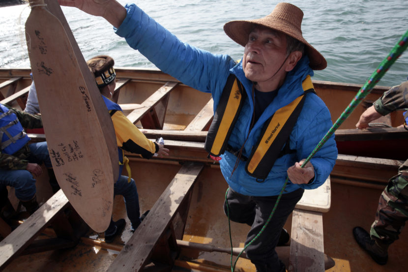 Ed Thomas, former President of the Central Council of Tlingit and Haida Indian Tribes of Alaska helps load a canoe before finishing a paddle from Angoon to Juneau on Wednesday, June 8, 2016, near Juneau, Alaska. The society began the trip on June 2. Their landing on Douglas Island is the unofficial beginning of Celebration. (Photo by Rashah McChesney/KTOO)