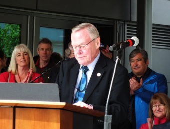 Juneau Sen. Dennis Egan addresses a crowd during grand opening of the Father Andrew P. Kashevaroff Library, Archives and Museum Building on June 6, 2016. Also pictured are Juneau Rep. Cathy Munoz, Juneau Rep. Sam Kito III, and Senate Finance Committee co-chair Anna MacKinnon.