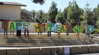Stanford has found itself in a string of high-profile sexual assault cases. During a demonstration last September, students held a sign about rape at the university's White Plaza, during New Student Orientation. Tessa Ormenyi/AP