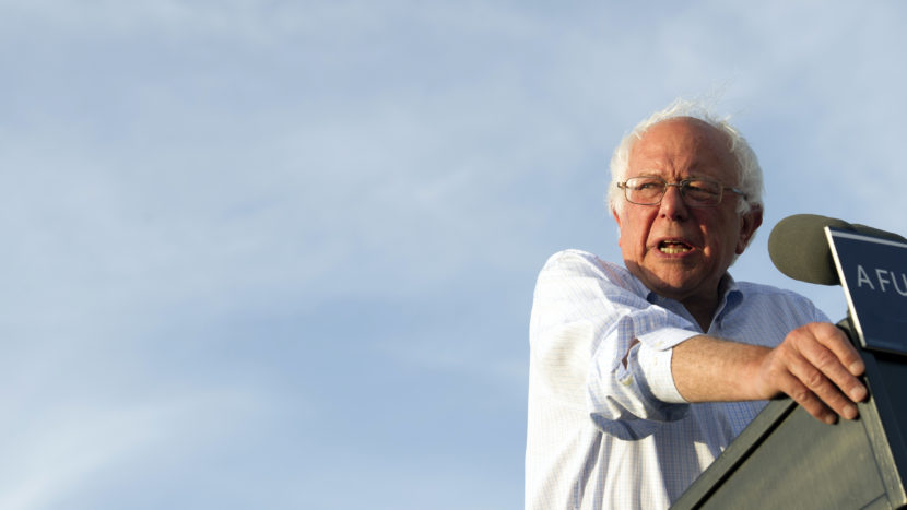 Bernie Sanders says he will vote for Clinton, but still won't endorse her. He wants her to back a $15 minimum wage and tuition-free state college. Cliff Owen/AP
