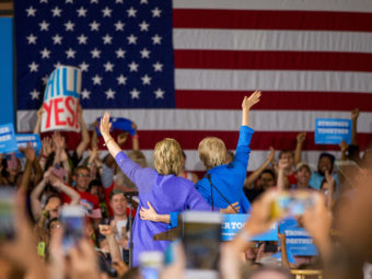 Sen. Elizabeth Warren (right) introduces Democratic presidential candidate Hillary Clinton at a rally at the Cincinnati Museum Center at Union Terminal on Monday. Andrew Harnik/AP