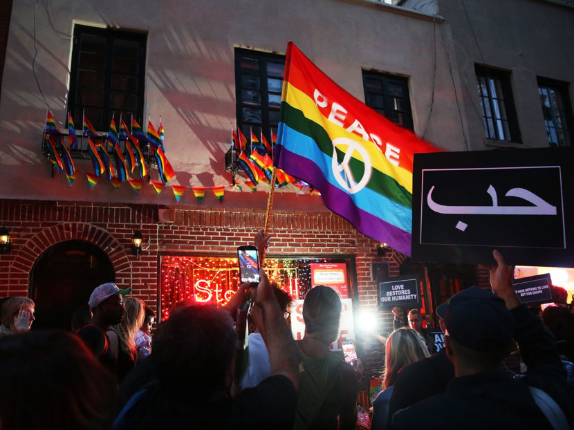 Mourners gather outside of the iconic New York City gay and lesbian bar the Stonewall Inn to light candles, lay flowers and grieve for those killed in Orlando last evening on June 12, 2016. Spencer Platt/Getty Images