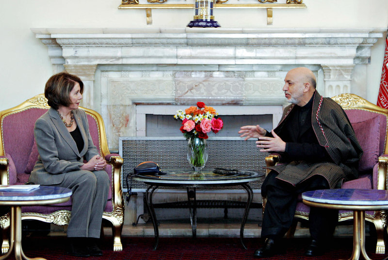 Zabihullah Tamanna was a photographer in Afghanistan for years. Here, one of his images of Afghanistan President Hamid Karzai (right) during a talk with U.S. House Speaker Nancy Pelosi at the Presidential Palace in Kabul on February 21, 2009. (Photo by Zabi Tamanna/AFP/Getty Images)