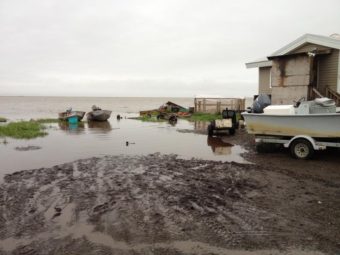 Decades of coastal erosion and storm surges have brought the Chukchi Sea to within a few feet of some homes, as shown in this 2010 photo. (Photo courtesy of State of Alaska)