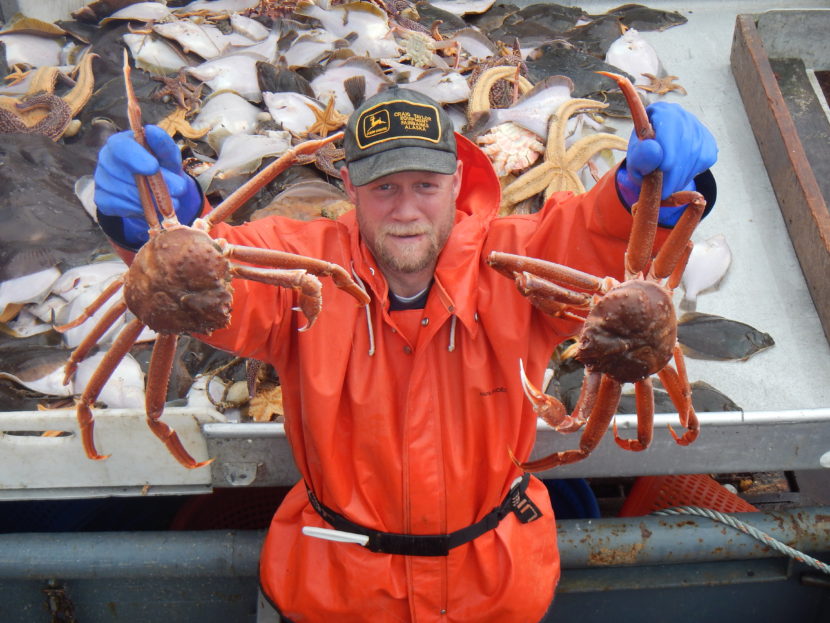 Bob Foy, director of the NOAA lab in Kodiak, holds up tanner crab, a species expected to be impacted by ocean acidification. (Photo courtesy NOAA's Fisheries Science Center)