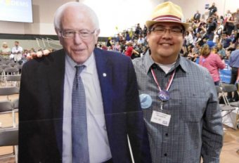 Gavin Hudson stands with a Bernie Sanders cardboard cutout during the Alaska Democratic Convention earlier this year. Hudson is headed to the Democratic National Convention in Philadelphia next week. (Photo courtesy Gavin Hudson)